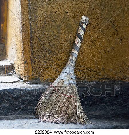 Picture - A broom sitting outside a doorway; Lhasa xizang china. Fotosearch