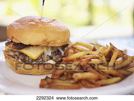 Picture - A hamburger and fries; Hawaii united states of america. Fotosearch