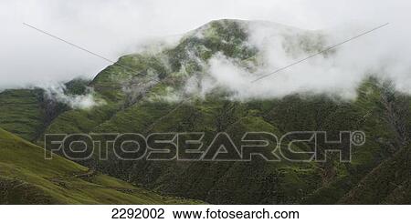 A rugged mountain top under the clouds; Xizang china View Large Photo Image Stock Image - A rugged mountain top under the clouds; Xizang china. Fotosearch