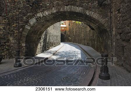 Stock Image - Archway over cobblestone streets; Guanajuato mexico. Fotosearch