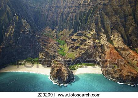Blue water and white sand in a small inlet along a rugged coastline; Hawaii united states of america View Large Photo Image Stock Image - Blue water and white sand in a small inlet along a rugged coastline; Hawaii united states of america. Fotosearch