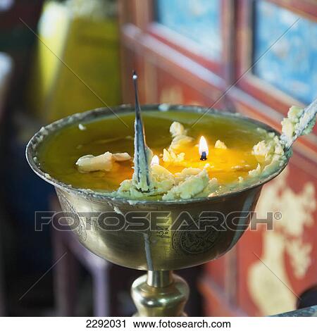 Candles burning in a round bronze container at drepung monastery; Lhasa xizang china View Large Photo Image Stock Image - Candles burning in a round bronze container at drepung monastery; Lhasa xizang china. Fotosearch