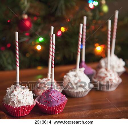 Decorated pink cake pops by a christmas tree; Edmonton alberta canada View Large Photo Image Picture - Decorated pink cake pops by a christmas tree; Edmonton alberta canada. Fotosearch