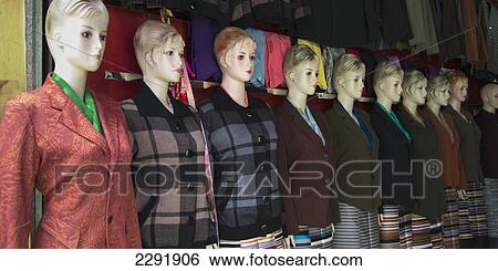 Female mannequins in fashionable clothing in a row; Lhasa xizang china View Large Photo Image Stock Photograph - Female mannequins in fashionable clothing in a row; Lhasa xizang china. Fotosearch