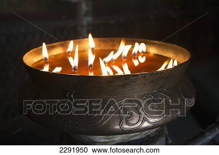 Flames burning in a bronze container at the jokhang temple; Lhasa xizang china View Large Photo Image Stock Image - Flames burning in a bronze container at the jokhang temple; Lhasa xizang china. Fotosearch