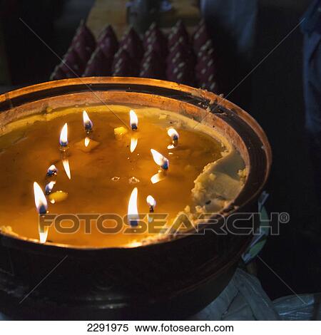 Flames burning in a large container; Lhasa xizang china View Large Photo Image Stock Photography - Flames burning in a large container; Lhasa xizang china. Fotosearch