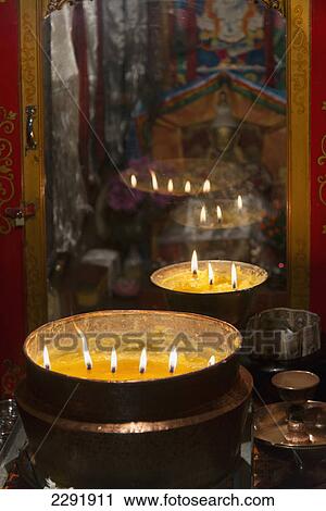 Flames burning in a row in large bronze pots; Lhasa xizang china View Large Photo Image Stock Image - Flames burning in a row in large bronze pots; Lhasa xizang china. Fotosearch