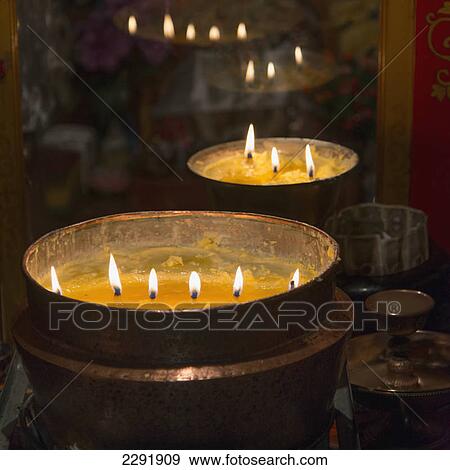 Flames burning in a row in large bronze pots; Lhasa xizang china View Large Photo Image Stock Photo - Flames burning in a row in large bronze pots; Lhasa xizang china. Fotosearch