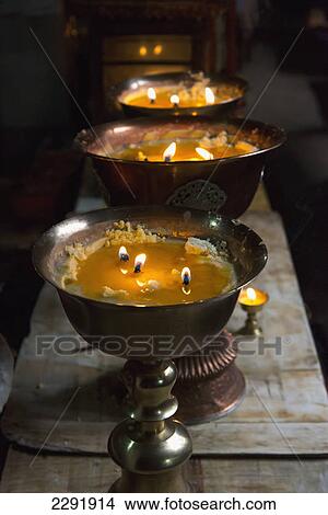 Picture - Flames burning in large bronze pots; Lhasa xizang china. Fotosearch