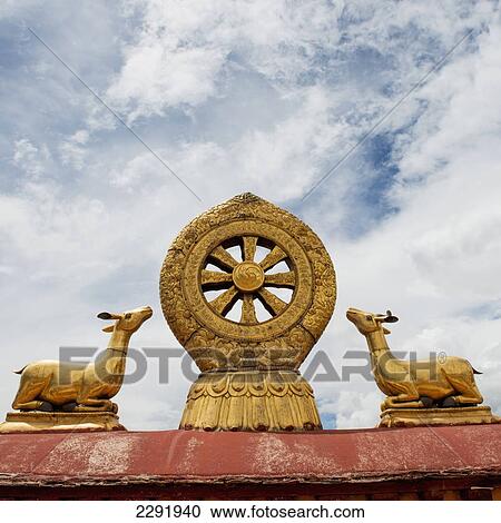 Stock Image - Golden statues of deers on the roof of the jokhang temple; Lhasa xizang china. Fotosearch