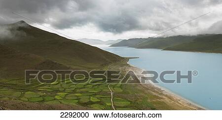 High angle view of farmland on the shore along sacred lake; Shannan xizang china View Large Photo Image Stock Image - High angle view of farmland on the shore along sacred lake; Shannan xizang china. Fotosearch