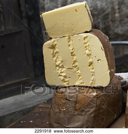 Stock Photo - Large pieces of cheese cut and piled; Lhasa xizang china. Fotosearch