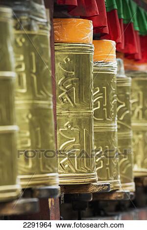 Picture - Ornate gold detail on a prayer wheel at potala palace; Lhasa xizang china. Fotosearch