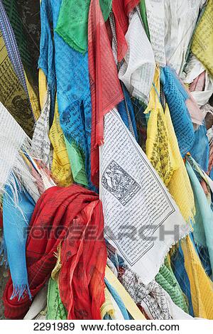 Pieces of fabric of various bright colours hanging together; Shannan xizang china View Large Photo Image Stock Photo - Pieces of fabric of various bright colours hanging together; Shannan xizang china. Fotosearch