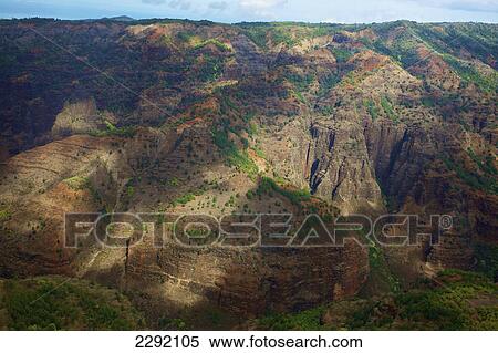 Rugged mountains with shadows cast by the clouds; Hawaii united states of america View Large Photo Image Stock Photography - Rugged mountains with shadows cast by the clouds; Hawaii united states of america. Fotosearch