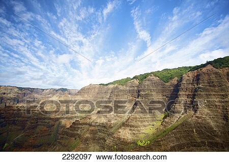 Rugged rock face of a mountainside; Hawaii united states of america View Large Photo Image Stock Photo - Rugged rock face of a mountainside; Hawaii united states of america. Fotosearch