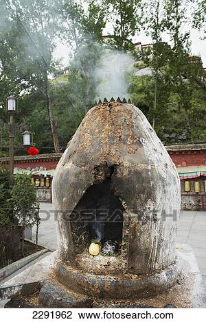 Stock Image - Smoke coming from a round stone structure at potala palace; Lhasa xizang china. Fotosearch