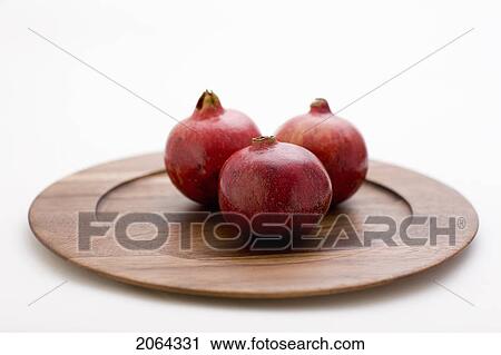 3 Pomegranates On Wooden Plate View Large Photo Image Stock Image - 3 Pomegranates On Wooden Plate. Fotosearch