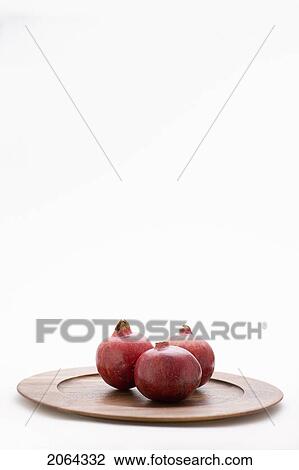 3 Pomegranates On Wooden Plate View Large Photo Image Stock Image - 3 Pomegranates On Wooden Plate. Fotosearch