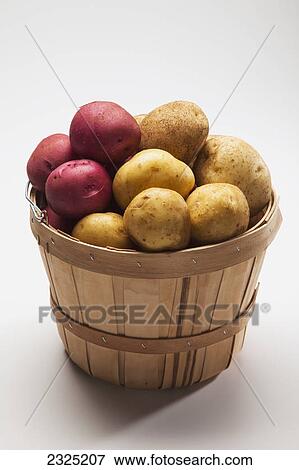 A basket full of white and red potatoes View Large Photo Image Stock Photo - A basket full of white and red potatoes. Fotosearch