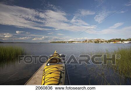 Stock Photograph - A Beautiful Summer Day On A Dock Overlooking The Back Bay Portion Of The Great Slave Lake In Yellowknife, Northwest Territories.. Fotosearch