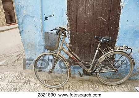 A Bicycle Leaning Against A Weathered Wall; Casablanca Morocco View Large Photo Image Stock Image - A Bicycle Leaning Against A Weathered Wall; Casablanca Morocco. Fotosearch