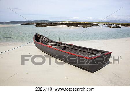 A boat on the beach on mannin bay near ballyconneely; County galway ireland View Large Photo Image Stock Image - A boat on the beach on mannin bay near ballyconneely; County galway ireland. Fotosearch
