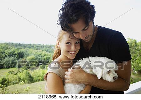 A Couple With Their Dog; Wailua Kauai Hawaii United States Of America View Large Photo Image Stock Photography - A Couple With Their Dog; Wailua Kauai Hawaii United States Of America. Fotosearch