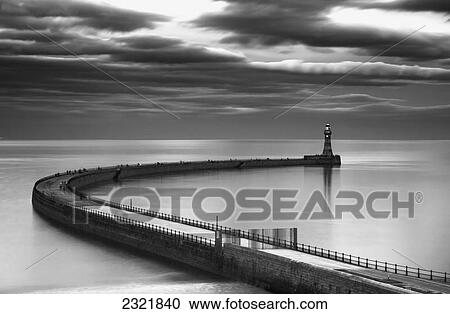 A Curving Pier With A Lighthouse At The End; Sunderland Tyne And Wear England View Large Photo Image Stock Image - A Curving Pier With A Lighthouse At The End; Sunderland Tyne And Wear England. Fotosearch