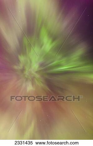 A green and orange northern lights corona in the sky above the tony knowles coastal trail in winter; Anchorage alaska united states of america View Large Photo Image Stock Photography - A green and orange northern lights corona in the sky above the tony knowles coastal trail in winter; Anchorage alaska united states of america. Fotosearch