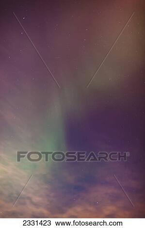 A green northern lights corona in the sky above the tony knowles coastal trail in winter; Anchorage alaska united states of america View Large Photo Image Stock Image - A green northern lights corona in the sky above the tony knowles coastal trail in winter; Anchorage alaska united states of america. Fotosearch
