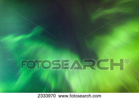 Stock Image - A Green Northern Lights Corona in the sky above the Tony Knowles Coastal Trail in winter; Anchorage, Alaska, United States of America. Fotosearch
