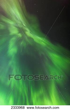 A Green Northern Lights Corona in the sky above the Tony Knowles Coastal Trail in winter; Anchorage, Alaska, United States of America View Large Photo Image Stock Photo - A Green Northern Lights Corona in the sky above the Tony Knowles Coastal Trail in winter; Anchorage, Alaska, United States of America. Fotosearch