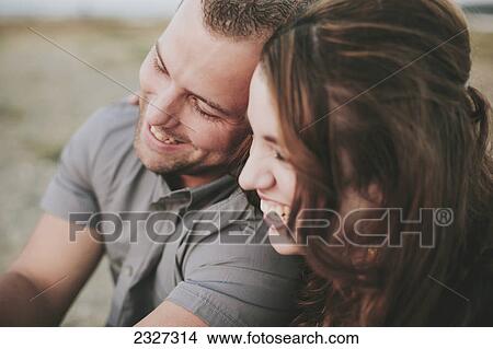 Picture - A man and woman laughing together; White rock british columbia canada. Fotosearch