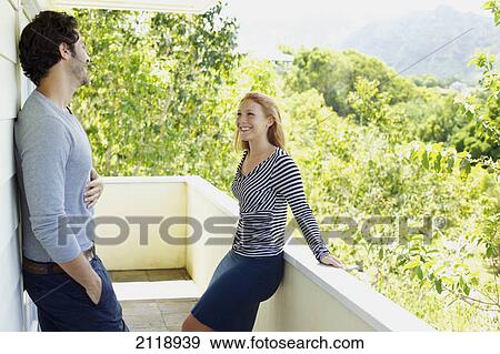 A Man And Woman Standing On A Balcony; Wailua Kauai Hawaii United States Of America View Large Photo Image Stock Photo - A Man And Woman Standing On A Balcony; Wailua Kauai Hawaii United States Of America. Fotosearch