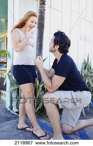 A Man Proposing To A Woman On Bended Knee; Kapaa Kauai Hawaii United States Of America View Large Photo Image Stock Photo - A Man Proposing To A Woman On Bended Knee; Kapaa Kauai Hawaii United States Of America. Fotosearch