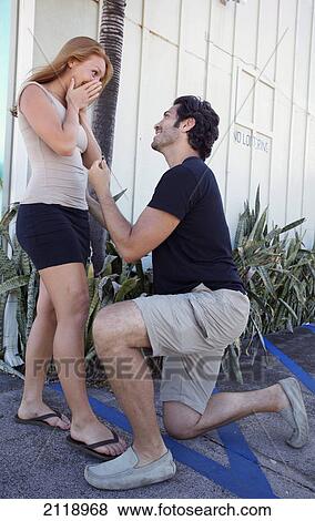 A Man Proposing To A Woman On Bended Knee; Kapaa Kauai Hawaii United States Of America View Large Photo Image Stock Photo - A Man Proposing To A Woman On Bended Knee; Kapaa Kauai Hawaii United States Of America. Fotosearch