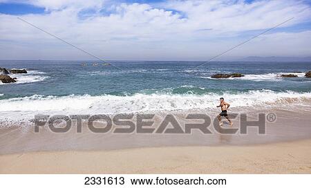 A man runs along the beach; Puerto vallarta mexico View Large Photo Image Stock Image - A man runs along the beach; Puerto vallarta mexico. Fotosearch
