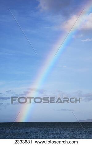 Stock Image - A partial rainbow over the ocean; Kaanapali, Maui, Hawaii, United States of America. Fotosearch
