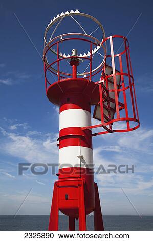 A red and white beacon at the water's edge; Vlissingen zealand netherlands View Large Photo Image Stock Image - A red and white beacon at the water's edge; Vlissingen zealand netherlands. Fotosearch
