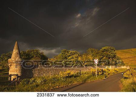 A road under dark storm clouds; Northumberland england View Large Photo Image Stock Photo - A road under dark storm clouds; Northumberland england. Fotosearch