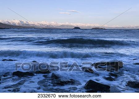 A rocky shoreline is exposed as the tide receeds in favorite channel inside passage; Alaska united states of america View Large Photo Image Stock Image - A rocky shoreline is exposed as the tide receeds in favorite channel inside passage; Alaska united states of america. Fotosearch