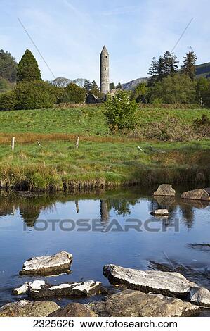A round tower with the reflection in a tranquil pond in the foreground; Glendalough county wicklow ireland View Large Photo Image Stock Photograph - A round tower with the reflection in a tranquil pond in the foreground; Glendalough county wicklow ireland. Fotosearch