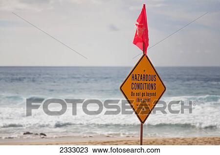 A sign on the beach for hazardous conditions; Honolulu oahu hawaii united states of america View Large Photo Image Stock Image - A sign on the beach for hazardous conditions; Honolulu oahu hawaii united states of america. Fotosearch