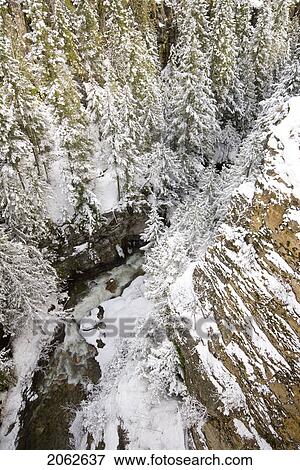 Stock Photo - A Snowy River Gorge, Revelstoke, Bc, Canada. Fotosearch
