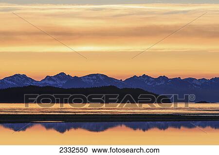 A tide pool reflects the evening sky eagle beach state recreation area with the chilkat mountains and lynn canal in the distance; Alaska united states of america View Large Photo Image Stock Image - A tide pool reflects the evening sky eagle beach state recreation area with the chilkat mountains and lynn canal in the distance; Alaska united states of america. Fotosearch
