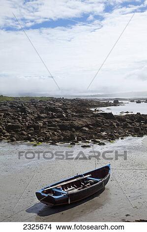 Picture - A traditional boat on the shore near roundstone; County galway ireland. Fotosearch