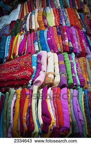 A variety of colourful fabric folded in rows; Jodhpur, Rajasthan, India View Large Photo Image Stock Image - A variety of colourful fabric folded in rows; Jodhpur, Rajasthan, India. Fotosearch
