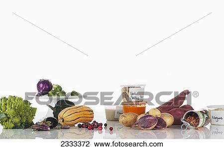 A variety of fresh produce and healthy foods on a white background View Large Photo Image Stock Image - A variety of fresh produce and healthy foods on a white background. Fotosearch