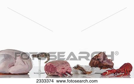 A variety of meat and seafood on a white background View Large Photo Image Picture - A variety of meat and seafood on a white background. Fotosearch